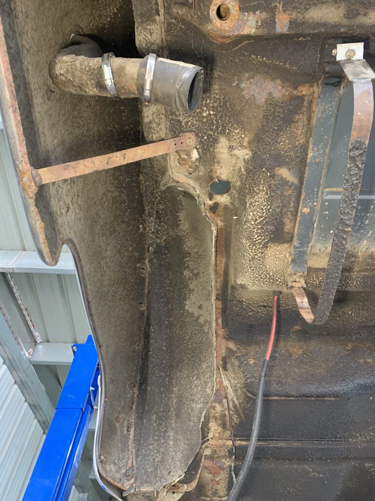 Wheel well on a truck before being dry ice blasted